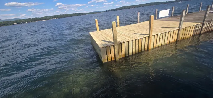 Finished timber dock corner and new crib face viewed across the water