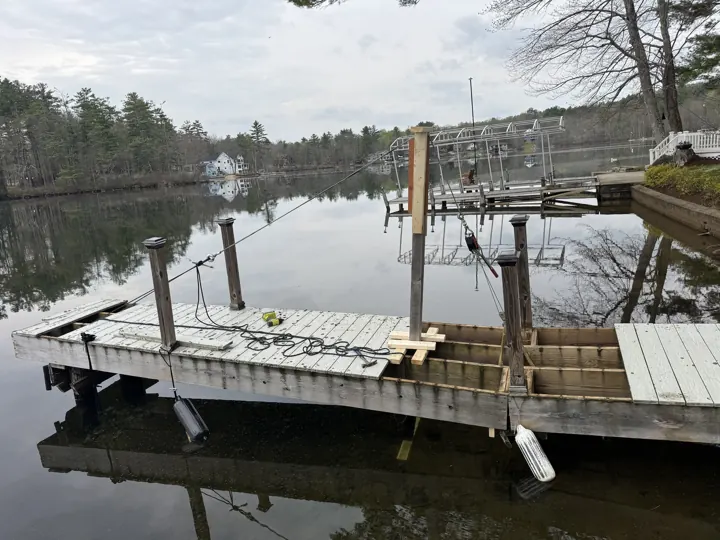 Rigging across the opened gray dock during the repair
