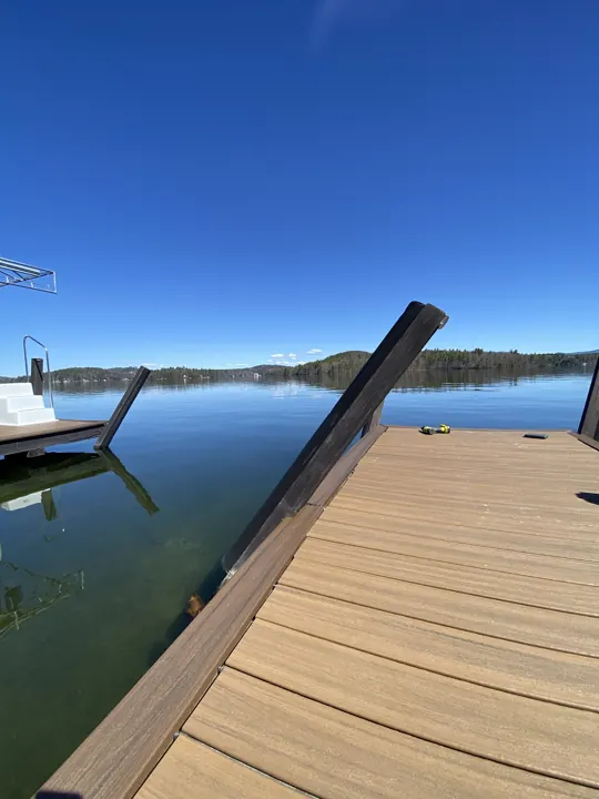 Dock post displaced from its base beside the composite deck