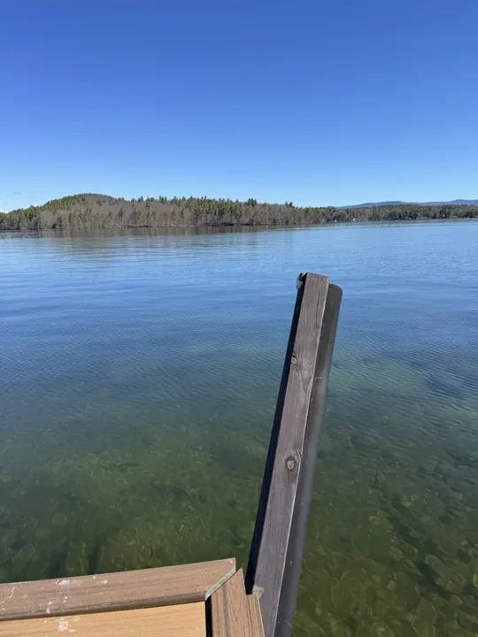 Timber post leaning away from the end of a composite dock