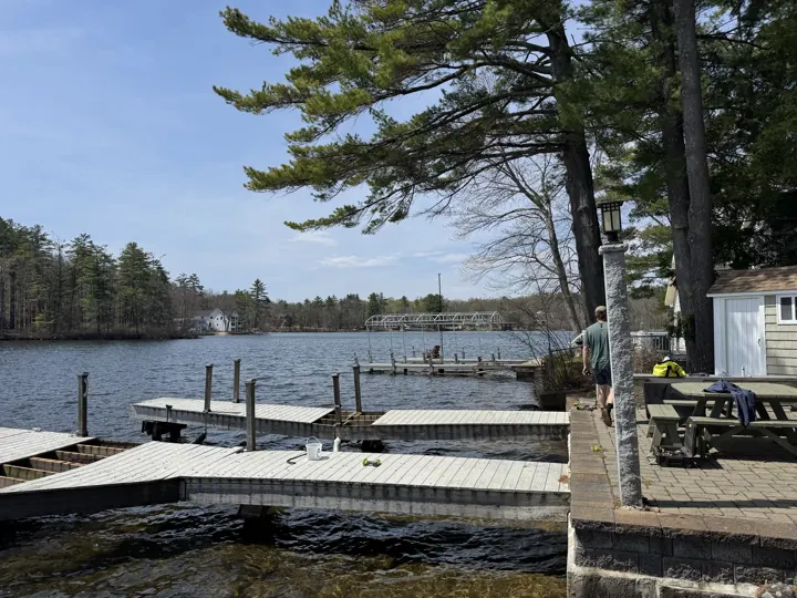 Wide view from shore showing the dock layout and surrounding shoreline