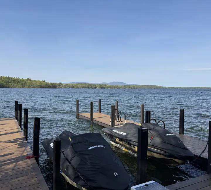 Finished composite dock beside covered watercraft, using the supplied crop without hanging gear